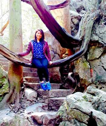 Sitting on a weirdly cool looking branch photo of me