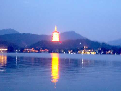 A shimmering pagoda and its reflection in West Lake shining pagoda and its reflection